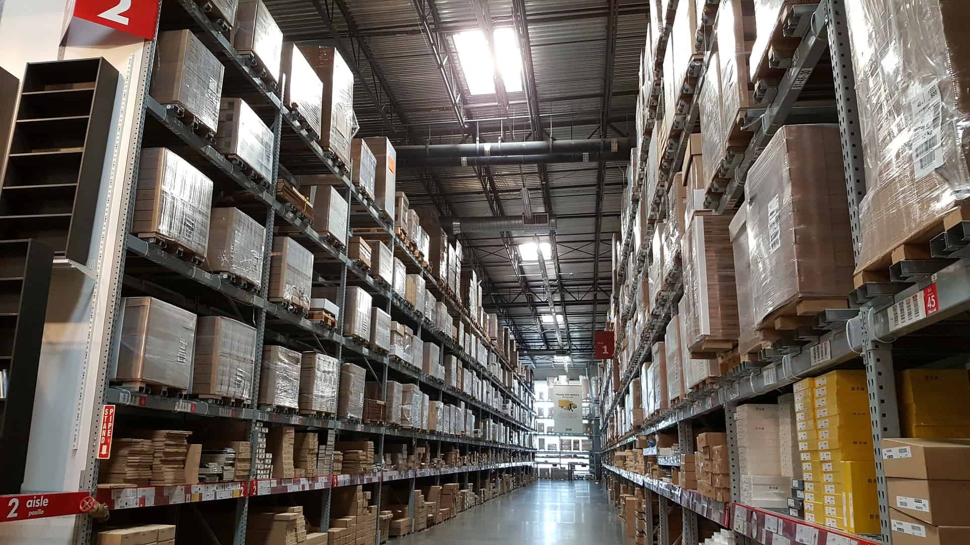 View of an aisle in a warehouse full of boxes