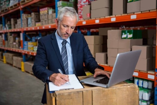 warehouse manager reviewing data about increased shipping accuracy
