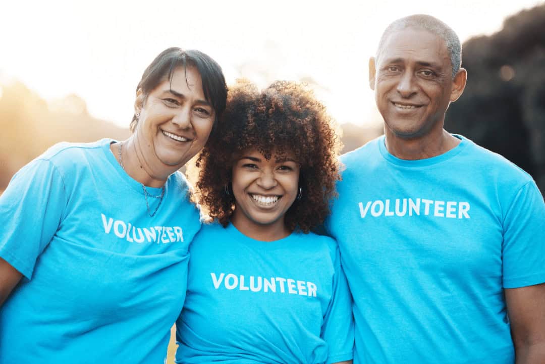 Volunteers working outside for charity.